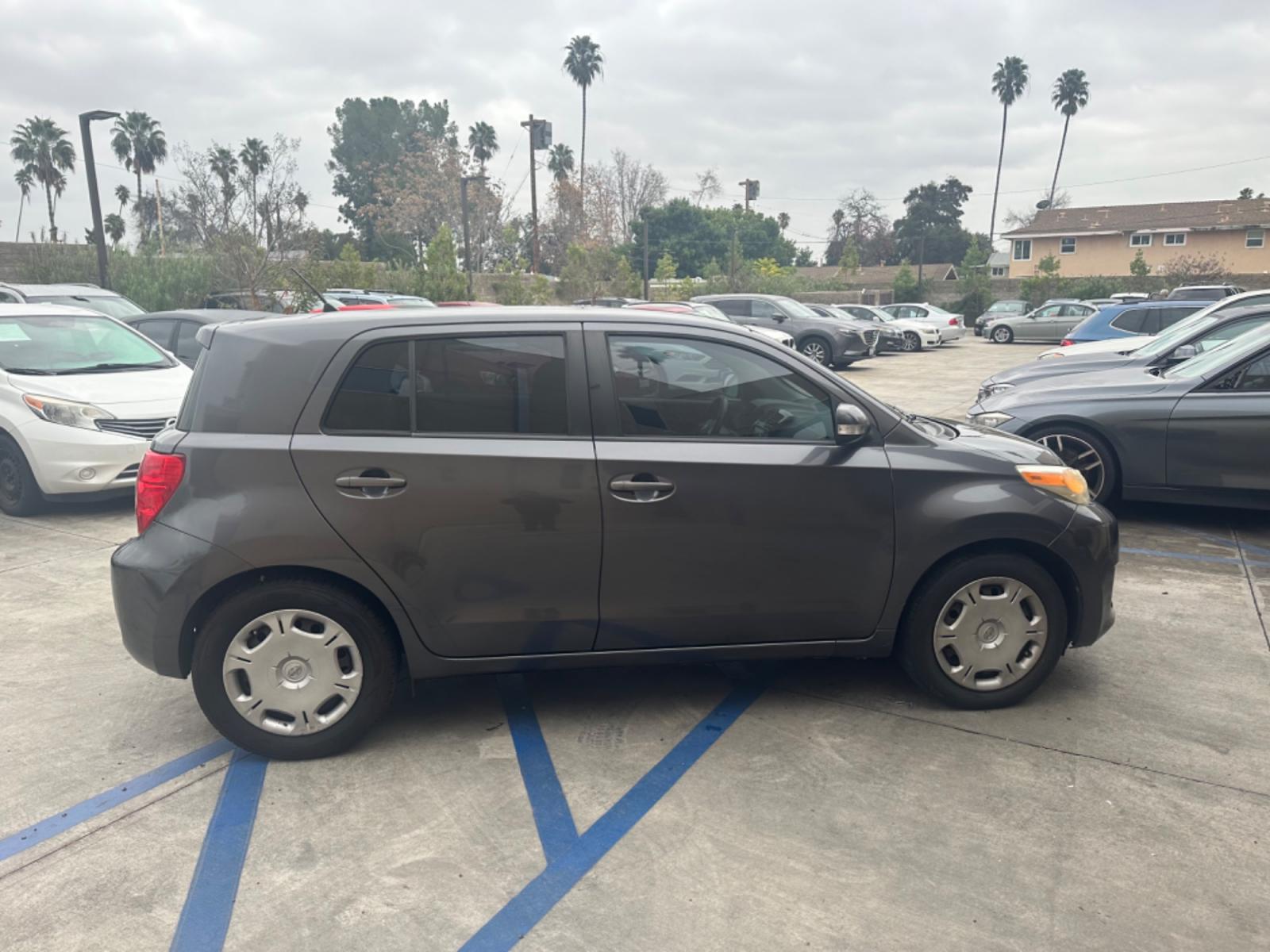 2009 Gray /Black Scion xD 5-Door (JTKKU104X9J) with an 1.8L L4 DOHC16V engine, automatic transmission, located at 30 S. Berkeley Avenue, Pasadena, CA, 91107, (626) 248-7567, 34.145447, -118.109398 - The 2009 Scion XD 4-Door Hatchback is a compact, versatile, and stylish vehicle that offers an exceptional driving experience. Located in the heart of Pasadena, CA, our dealership specializes in a comprehensive selection of used BHPH (Buy Here Pay Here) cars, including the dynamic Scion XD. This veh - Photo #3